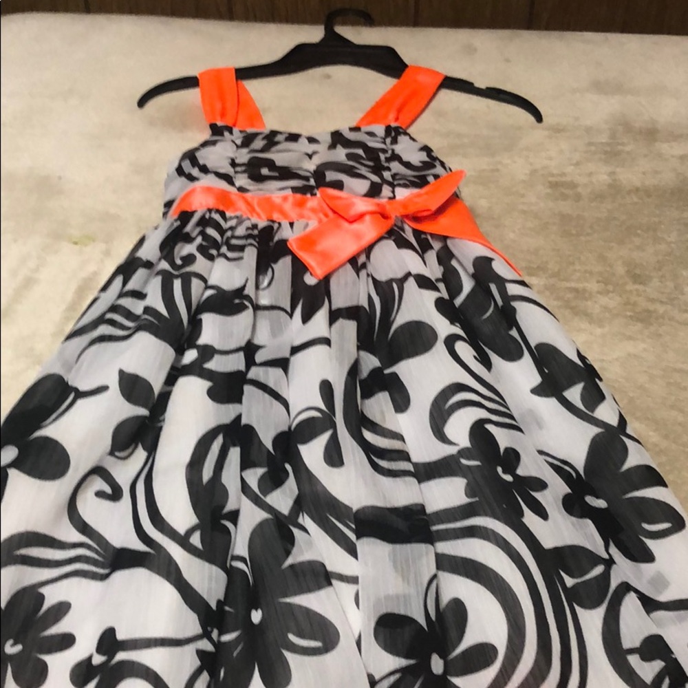 A black white and orange dress